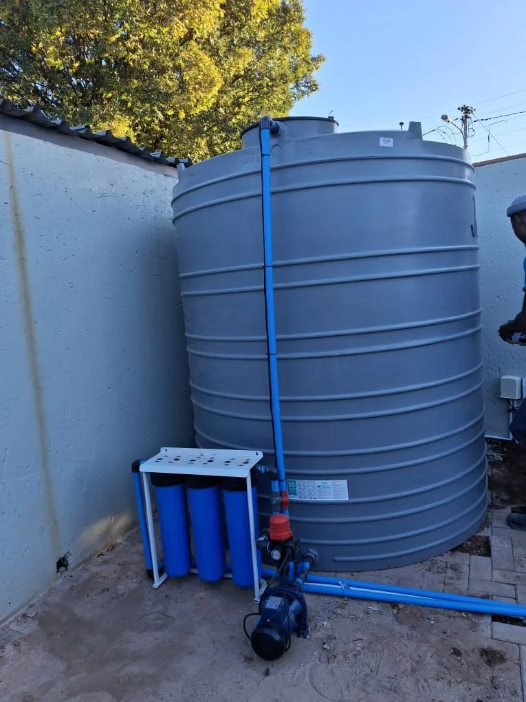 Large outdoor water storage tank installed at an industrial facility